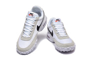Top and front views of the white and grey Nike Air Max Waffle SP sneakers.