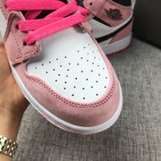 Close-up of the perforated white toe box, pink overlays and bright pink laces.