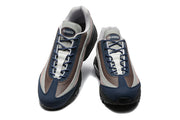 Top view of the pair showing navy laces and A Ma Manière tongue branding
