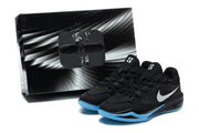 Black and blue basketball shoes pictured beside a black-and-white box