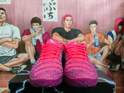 Front view of the pink and purple Nike sneakers showing the padded collars, laces, textured toe boxes, and purple outsoles.