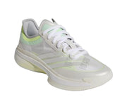 White basketball sneaker with pale green detailing and a light translucent outsole.