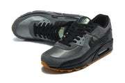 Pair of black and grey Nike Air Max 90 sneakers shown from above and at an angle