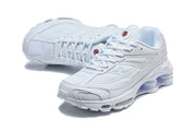 Angled top view of white Nike Shox Ride 2 sneakers.
