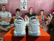 Rear view showing the perforated heel panels, KD markings and textured outsole.