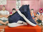 Pair of navy Nike Hyperdunk basketball shoes with black Swooshes and white soles