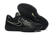 Black basketball sneakers displayed with one shoe lifted to show the textured rubber outsole.