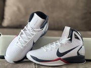 Close view of the lacing, perforations, and side panels on the basketball shoes