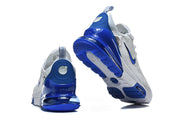 Rear and outsole views of the white and blue Nike Air Max 270 Premium sneakers.
