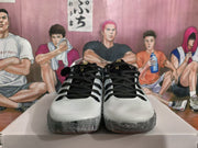 Front view of the matching pair with light gray toe panels, black laces, and translucent marbled outsoles.