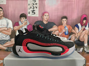Side profile showing the low-top silhouette, red layered side accents, and light-colored midsole area.