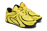 Three-quarter view of the yellow and black lace-up sneakers with contrasting trim and padded collars.