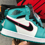 Close-up of the teal ankle panel, black winged emblem, and pink-trimmed black side accent.