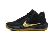 Side profile of a black Nike sneaker with a large gold Swoosh and gum-colored outsole.