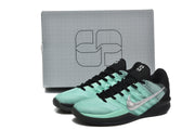 Pair of green-and-black basketball shoes with a matching logo box