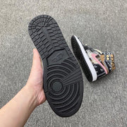 Outsole view showing the black rubber tread pattern and circular traction detail.