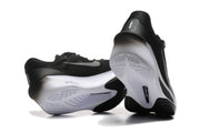 Rear and outsole views of black Nike Zoom Fly 6 shoes with white and gray details.