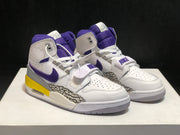 Front view of the pair highlighting the padded purple tongues, white laces, midfoot straps, and perforated toe boxes.