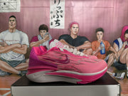 Side profile of pink and white Nike basketball sneakers with a bright pink outsole and heel structure.