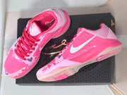 Pair of pink heart-patterned Kobe 5 basketball shoes shown from above and the side