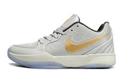 Side view of light gray Nike Ja 2 shoe with a gold side logo