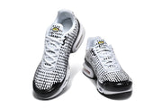 Top and front view of a pair of white and black Nike sneakers.