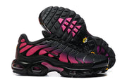 Outsole and side view of black and pink Nike Air Max Plus sneakers