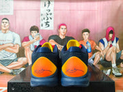 Rear view showing the shoes’ bright yellow-orange heel panels