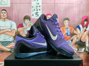 Purple Nike Kobe basketball shoes shown at an angled side view