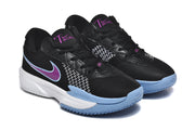 Three-quarter front view of the black sneaker pair with purple branding, white midsoles, and blue toe details.