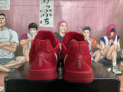 Rear view showing the red padded heel panels and white vertical detailing.