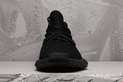 Front view showing the rounded toe, black laces, and textured upper.