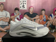 Side profile of a white Nike sneaker with silver swoosh, translucent side panel, and layered outsole detailing.