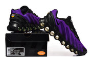 Purple and black Nike Air Max DN8 sneakers displayed with a shoe box; the box label shows a sample size.
