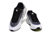 Front and top views of Nike Air Max sneakers with black laces and white patterned uppers.