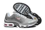Nike Air Max Plus VIII sneakers shown from the side and underside, with a black outsole and patterned grey upper.