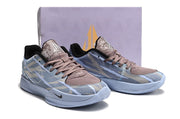 Pair of blue-gray camouflage Nike Ja 2 shoes in front of a shoe box