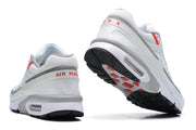 Rear and outsole views of Nike Air Max sneakers with red heel lettering