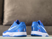 Rear view showing the blue heel panels, red number 8 details, white midsoles, and blue outsole edges.