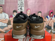 Rear view of the sneakers showing brown heel panels and visible cushioning units.