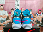 Rear view of the pair showing blue heel panels, pink accent marks, black ankle sections, and layered white outsoles.