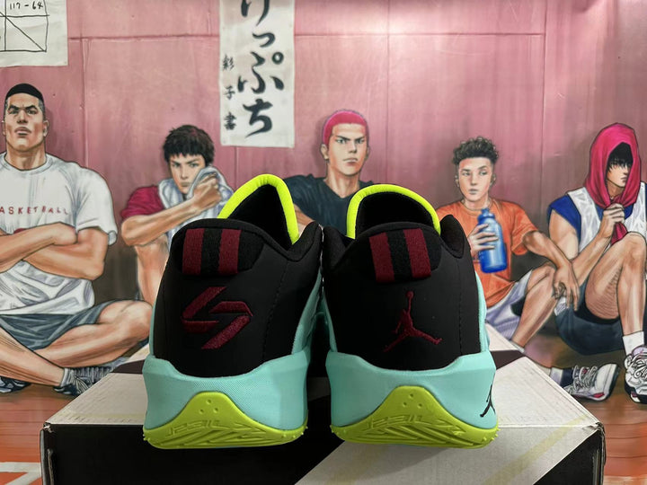 Rear view of light aqua basketball shoes with black heel panels and bright volt accents