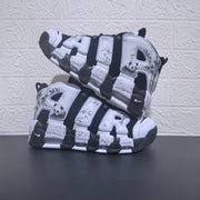 Air More Uptempo sneakers displayed one above the other, showing panda and bamboo-style side graphics.
