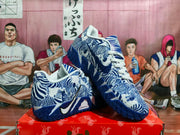 Three-quarter view of the navy and white patterned Nike basketball sneakers showing the side branding and textured outsole.