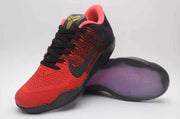 Front and outsole views of a red and black Nike Kobe 11 basketball shoe.