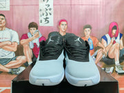 Front view of blue-grey and black Jordan Luka 1 basketball shoes with laces