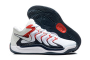 Angled outsole view showing the dark textured traction pattern and red circular detail.