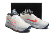 Light gray and coral Nike GT Hustle 3 pair shown at a front three-quarter angle.