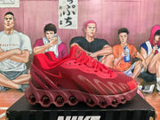 Side view of a red Nike Air Max Dn sneaker showing the layered upper, Nike Swoosh, and circular outsole elements.