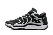 Side profile of a black and white sneaker with a layered white side structure, Nike swoosh, and contrasting midsole.
